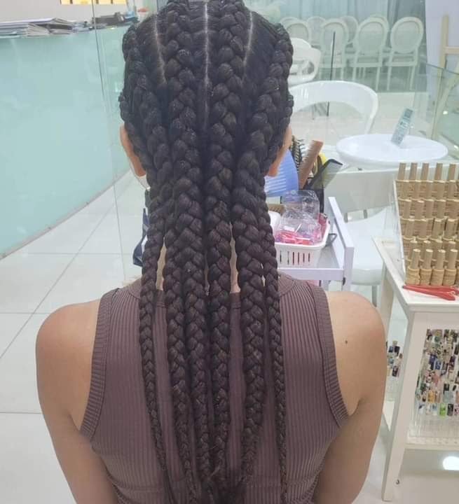 Hair stylist blow-drying and styling a client's hair at the best hair salon in Patong, Salima Massage & Beauty