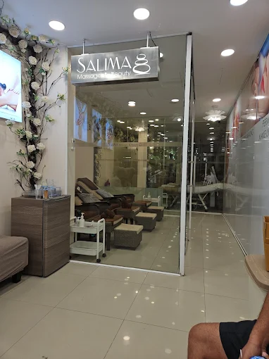 Therapist giving a relaxing facial massage to a client at a salon in Patong, Phuket